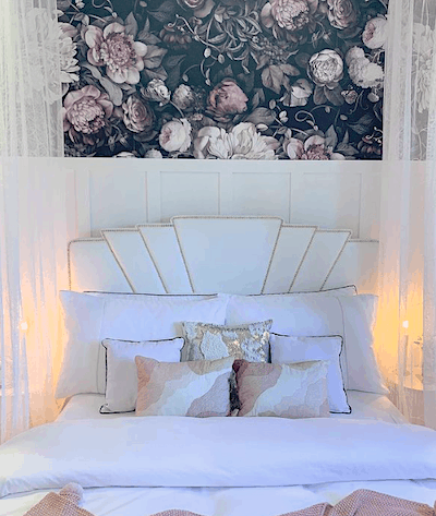 Dark floral wallpaper with white and soft pink decor