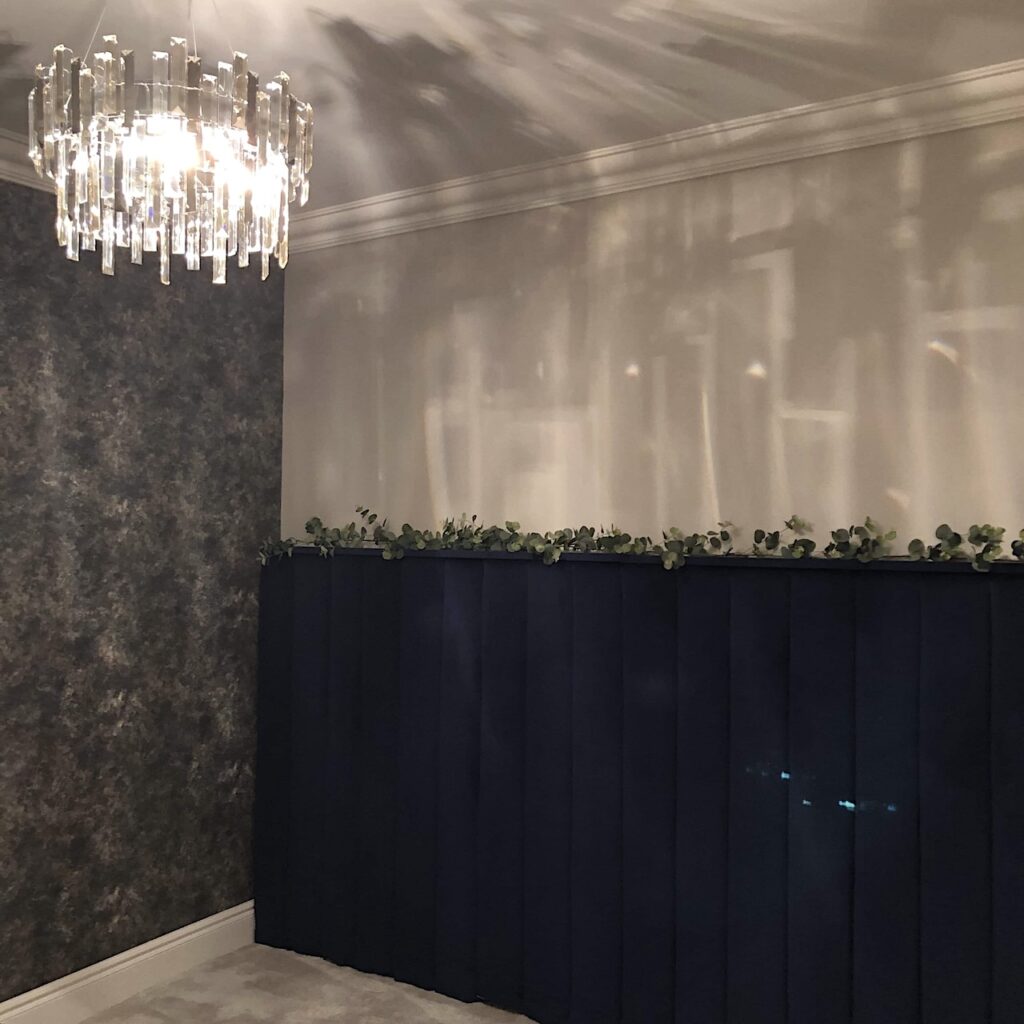Wall-to-wall navy blue fluted velvet headboard complete. Corner of the main bedroom fully renovation ready for furniture.