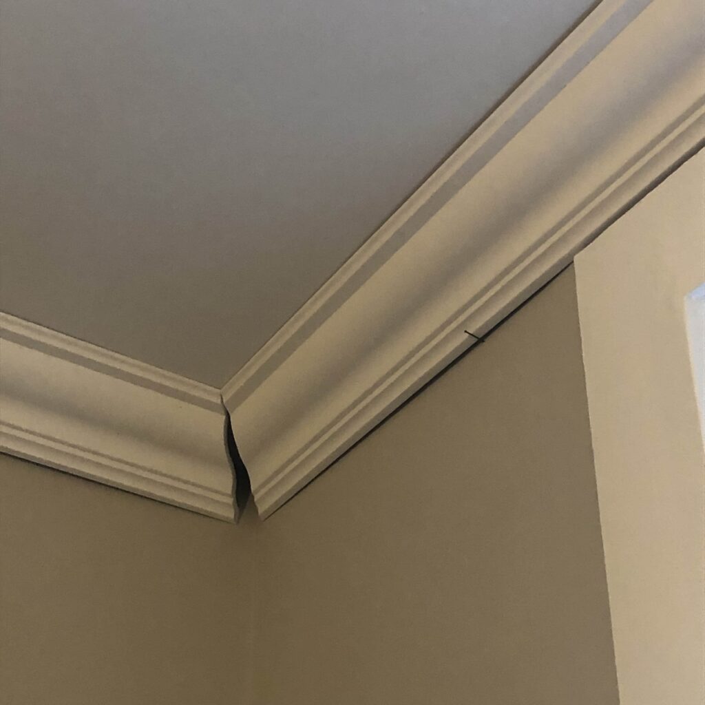 Ceiling coving mistakes - corner angles don't match.