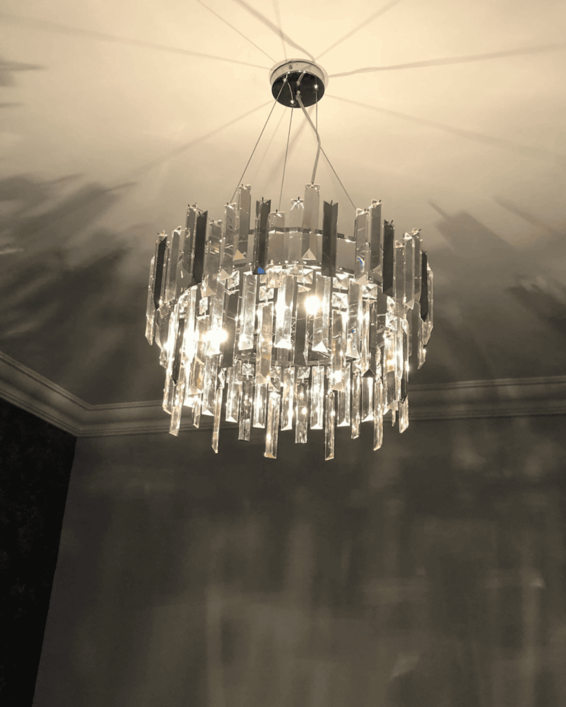 Main bedroom ceiling chandelier completed with crystals attached.