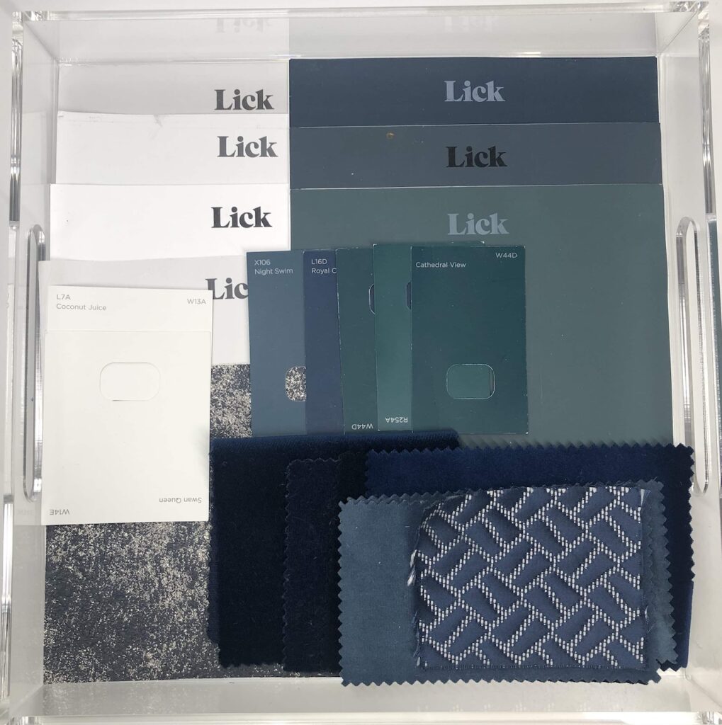 Collection of paint and fabric samples for main bedroom renovation. Colours include navy, dark greens and mix of greys.