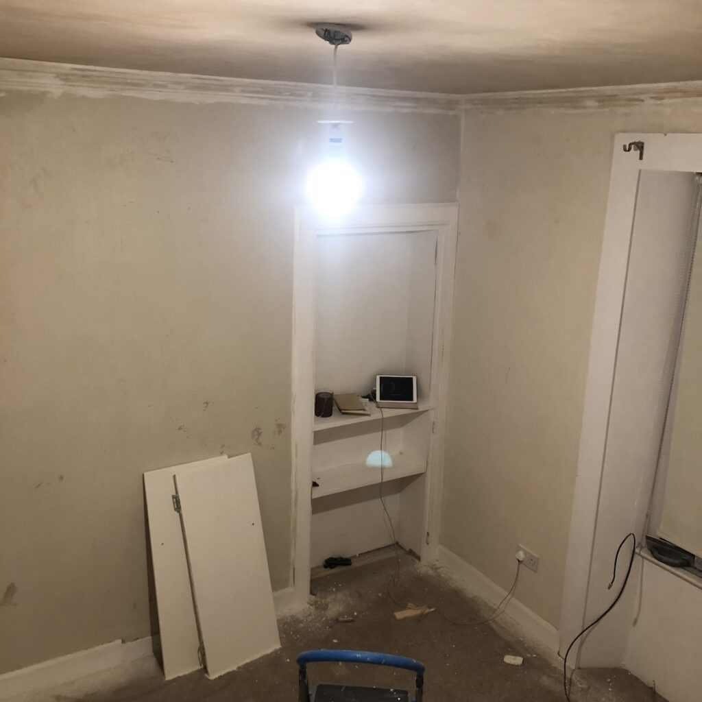 Living Room Mid Renovation with doors off and messy